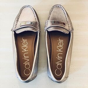 Calvin Klein gold loafers